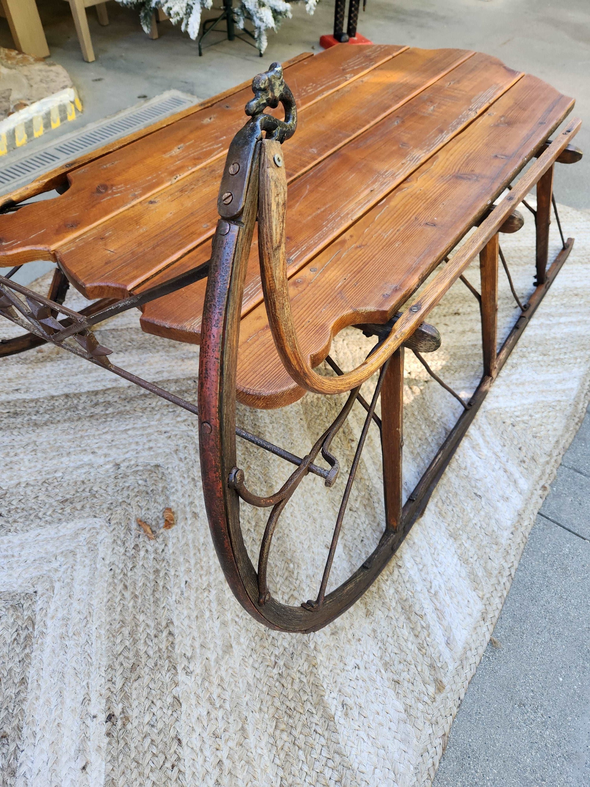 Antique pine sleigh with swan head detail and iron runners